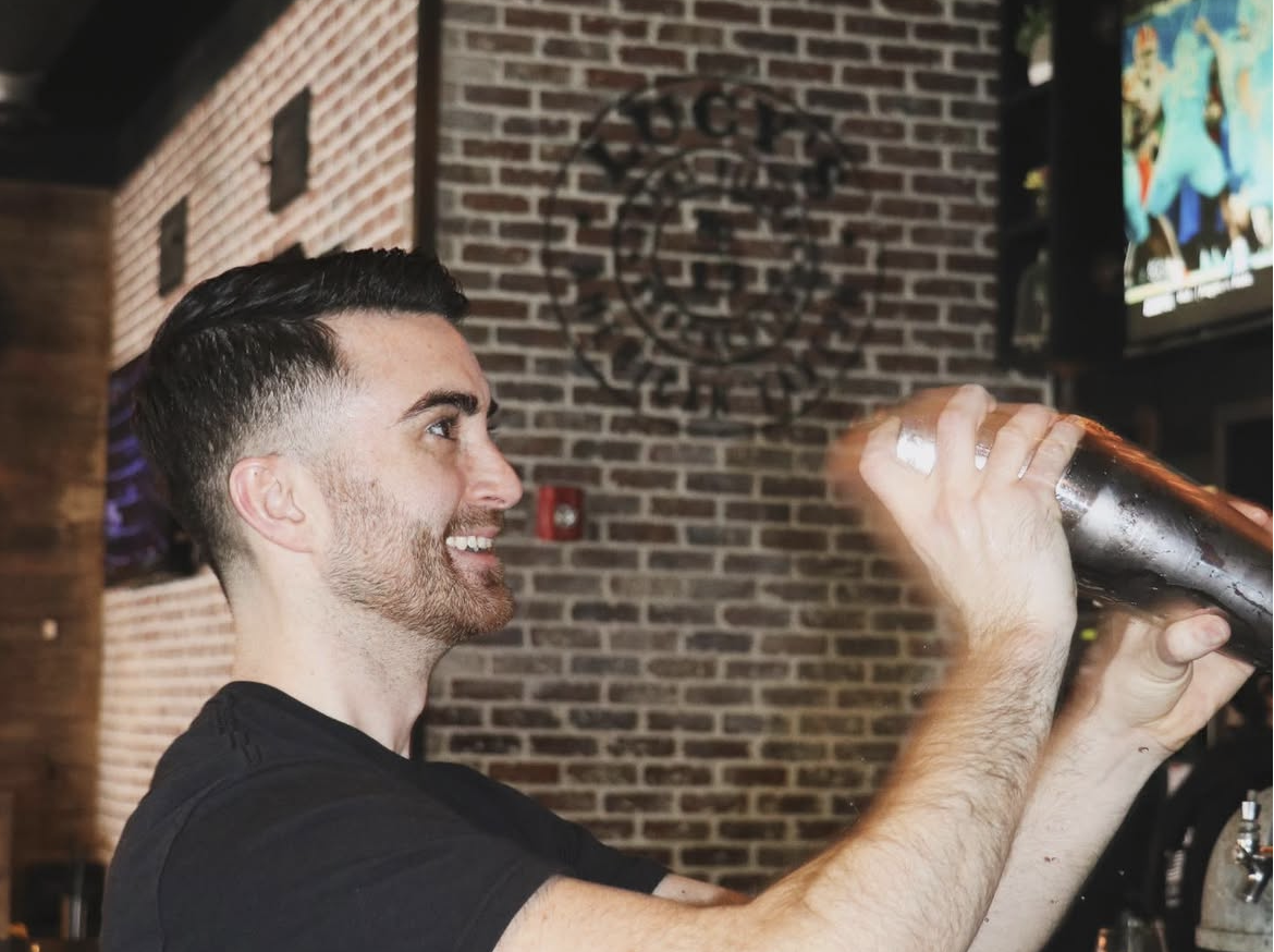 a person serving a drink