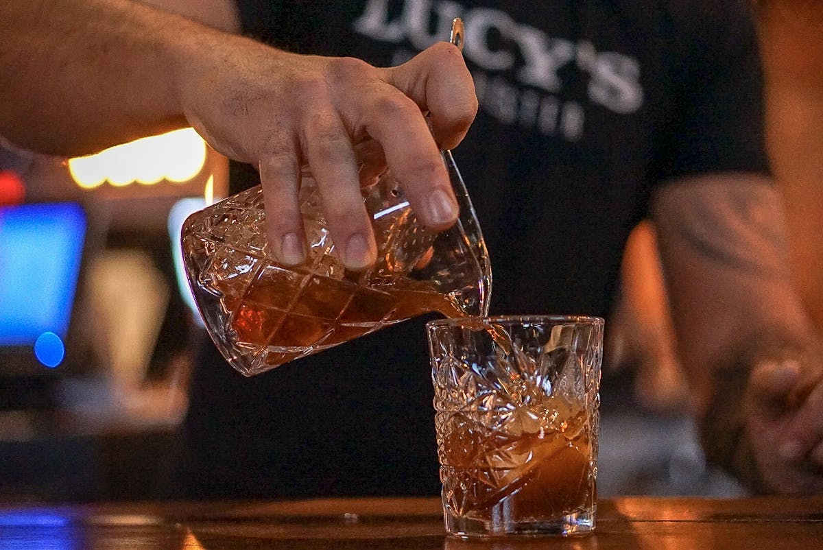 a bartender serving a drink