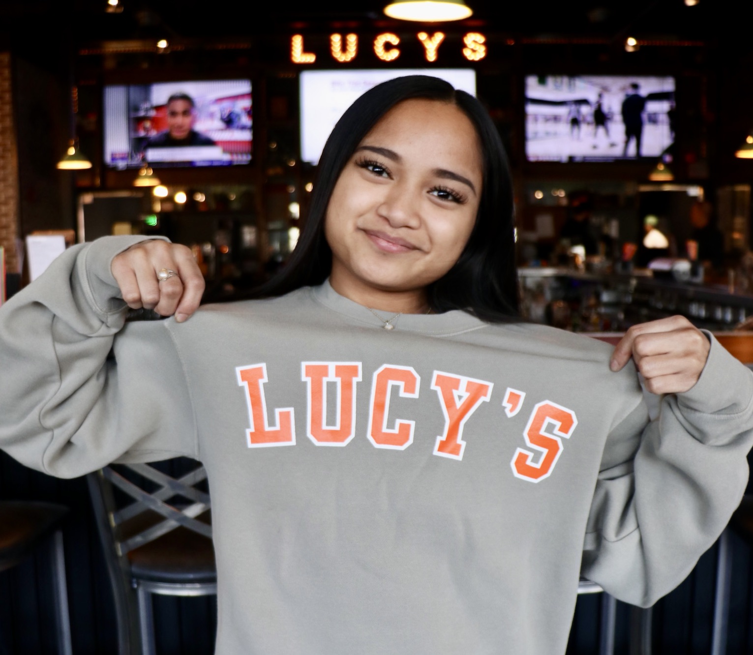 a person holding a sweater