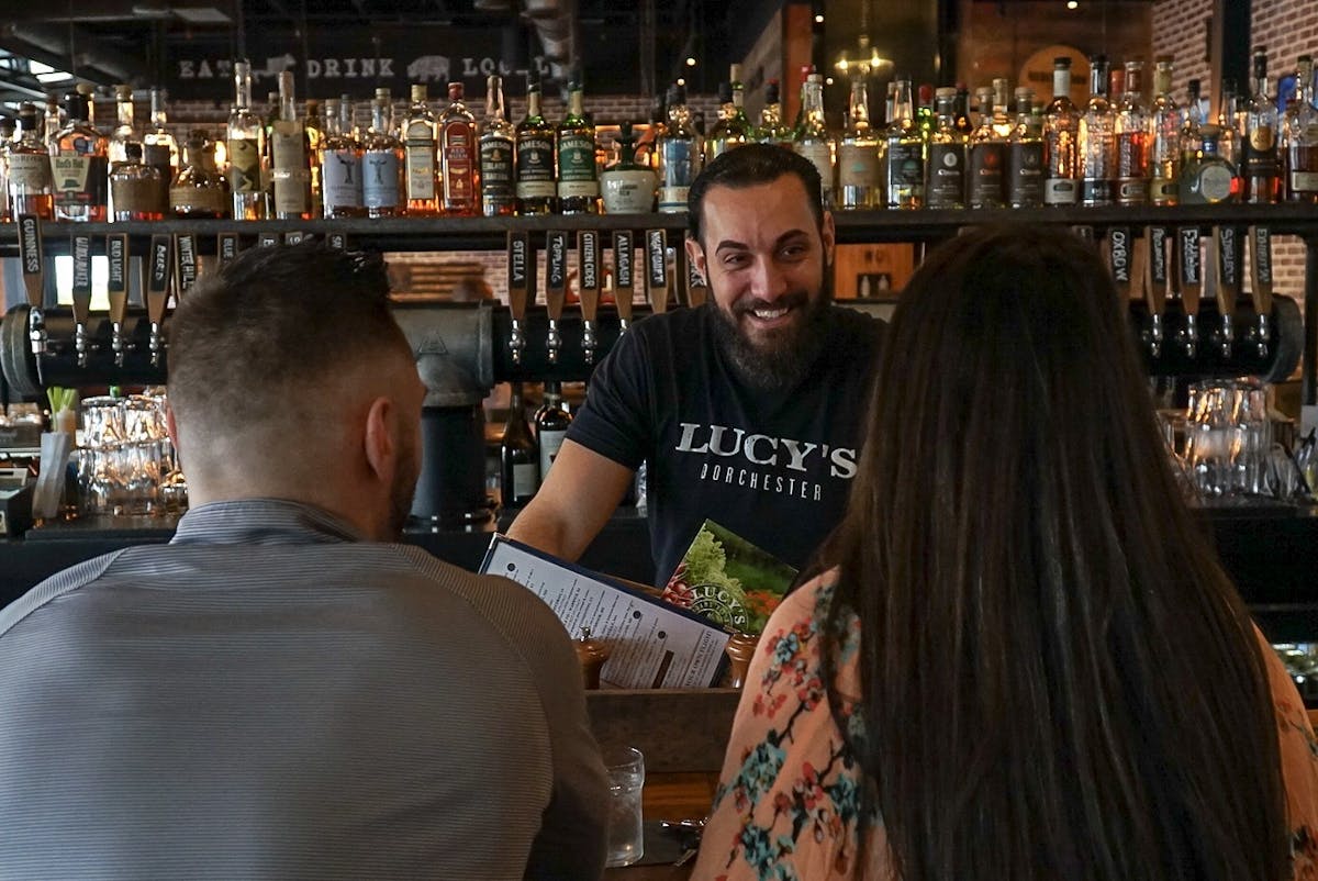 a group of people ordering food in a restaurant