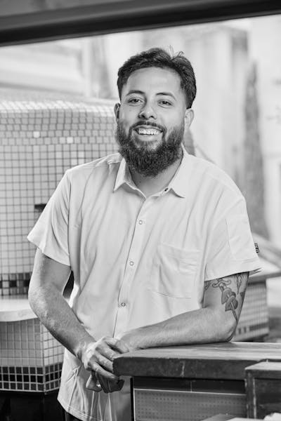 a man smiling to the camera