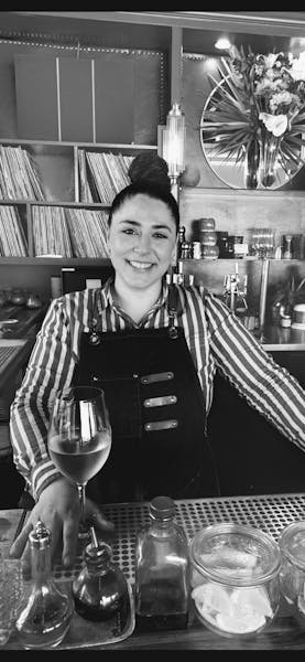 a woman holding a glass of champagne