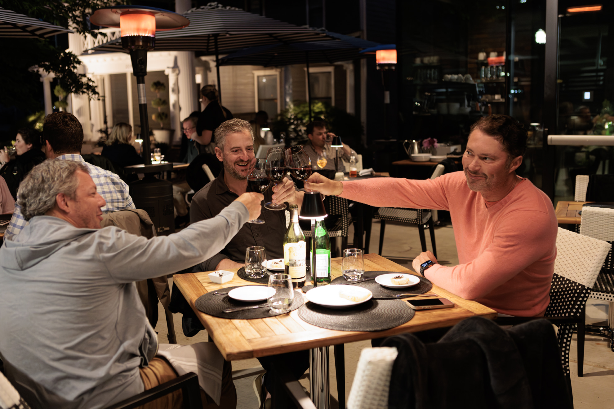 a group of people sitting at a table in a restaurant