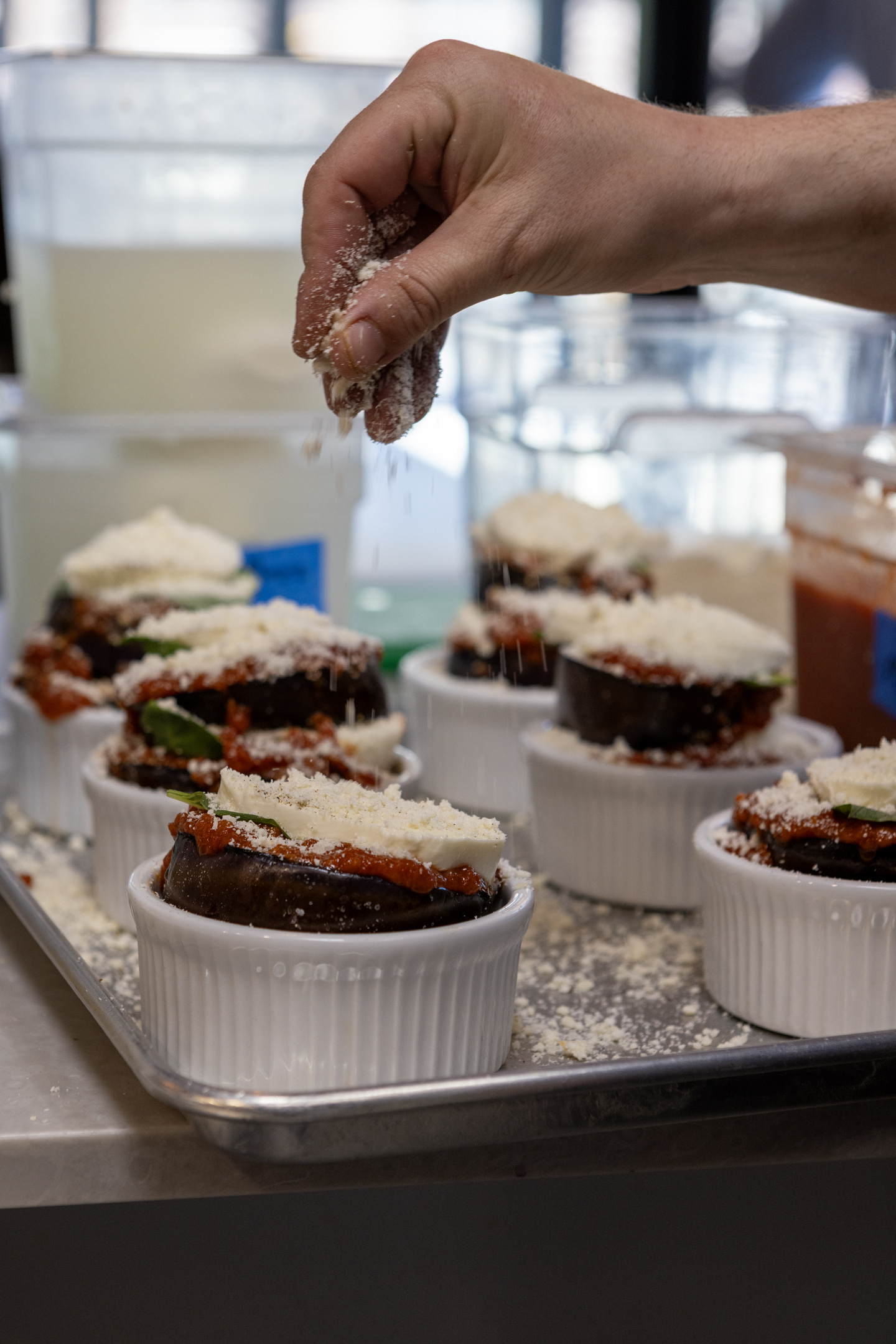 a person cutting a piece of cake on a table