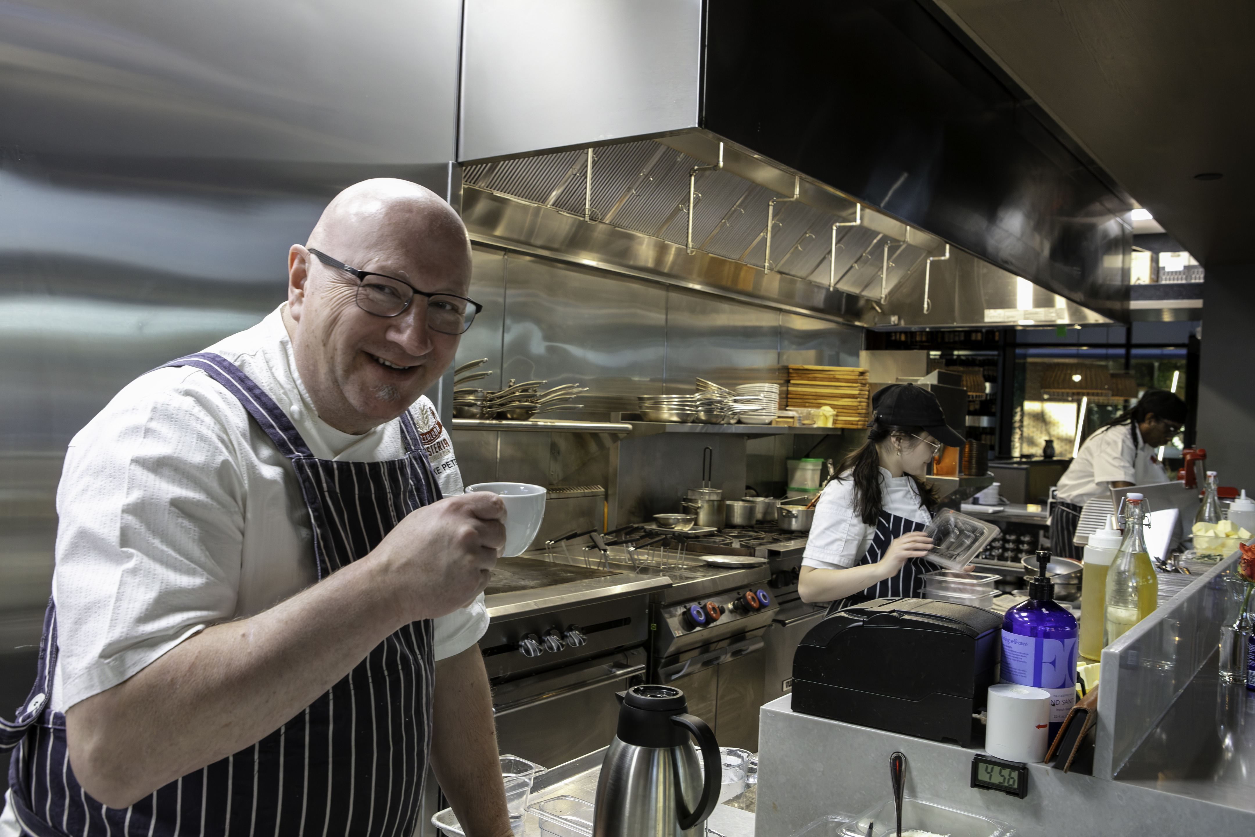 a man preparing food in a kitchen