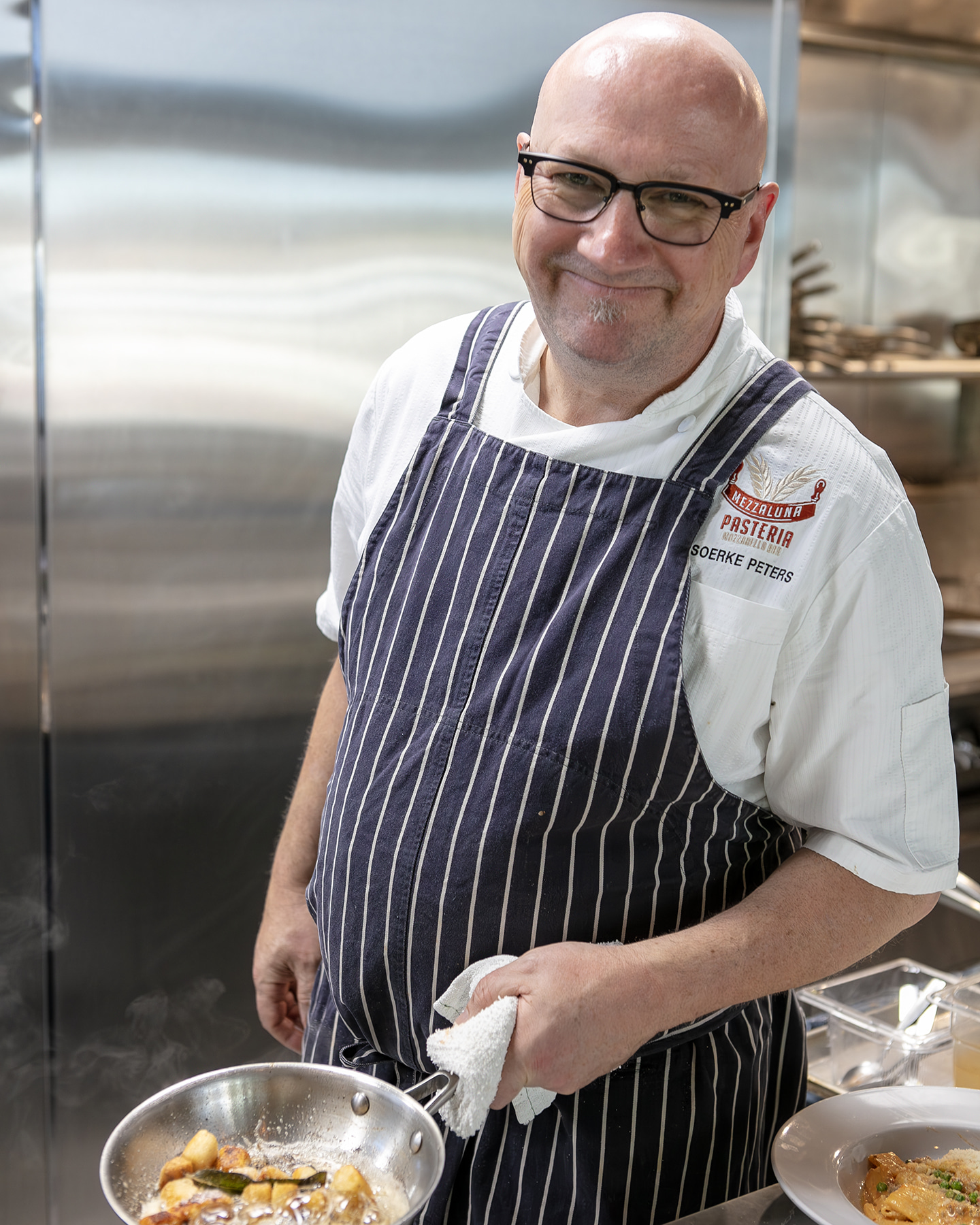 a man preparing food on a plate