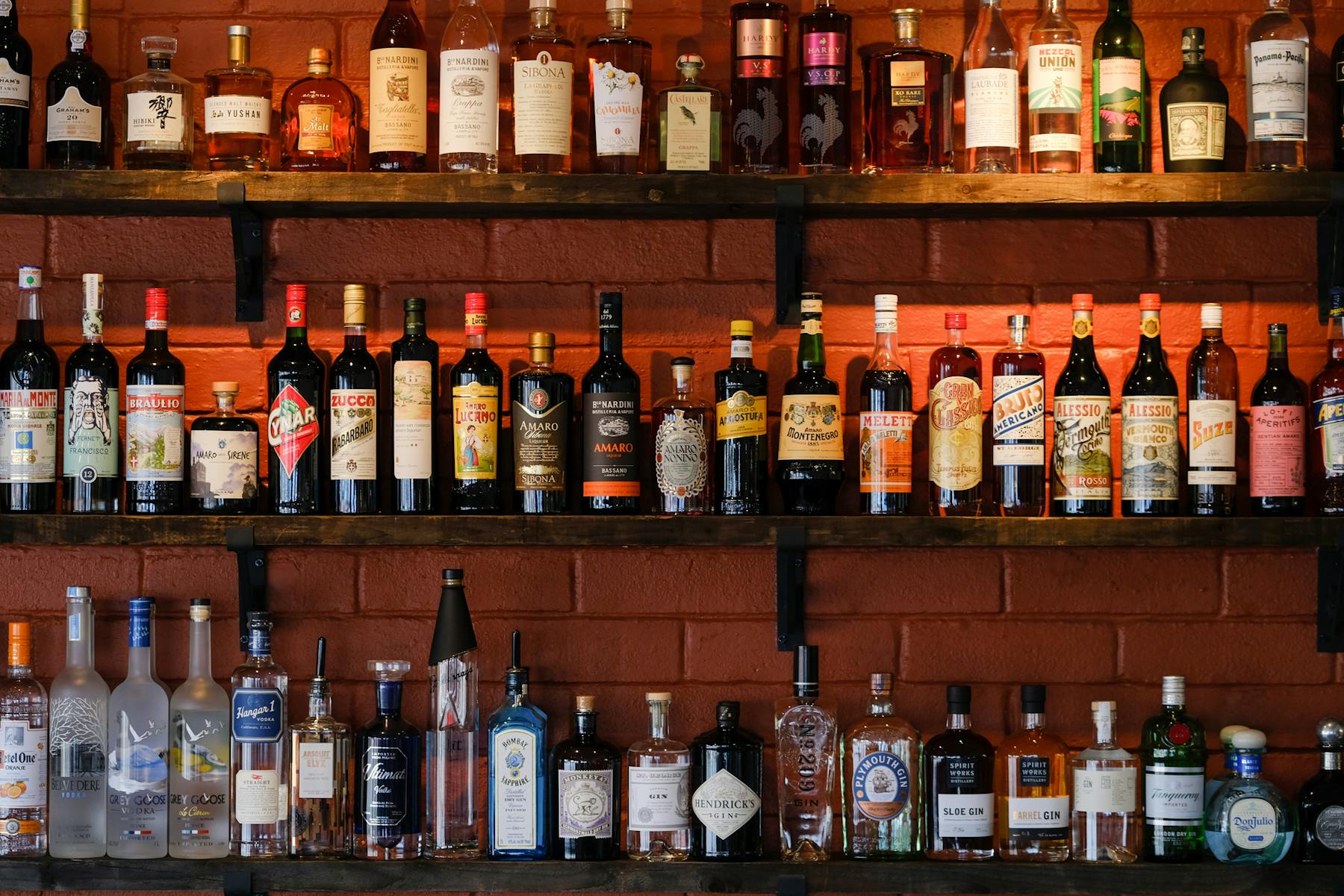 a row of beer glasses on a shelf