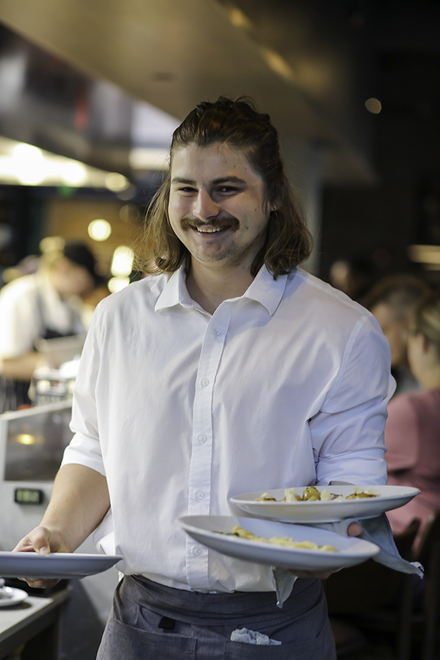 a person preparing food in a bowl