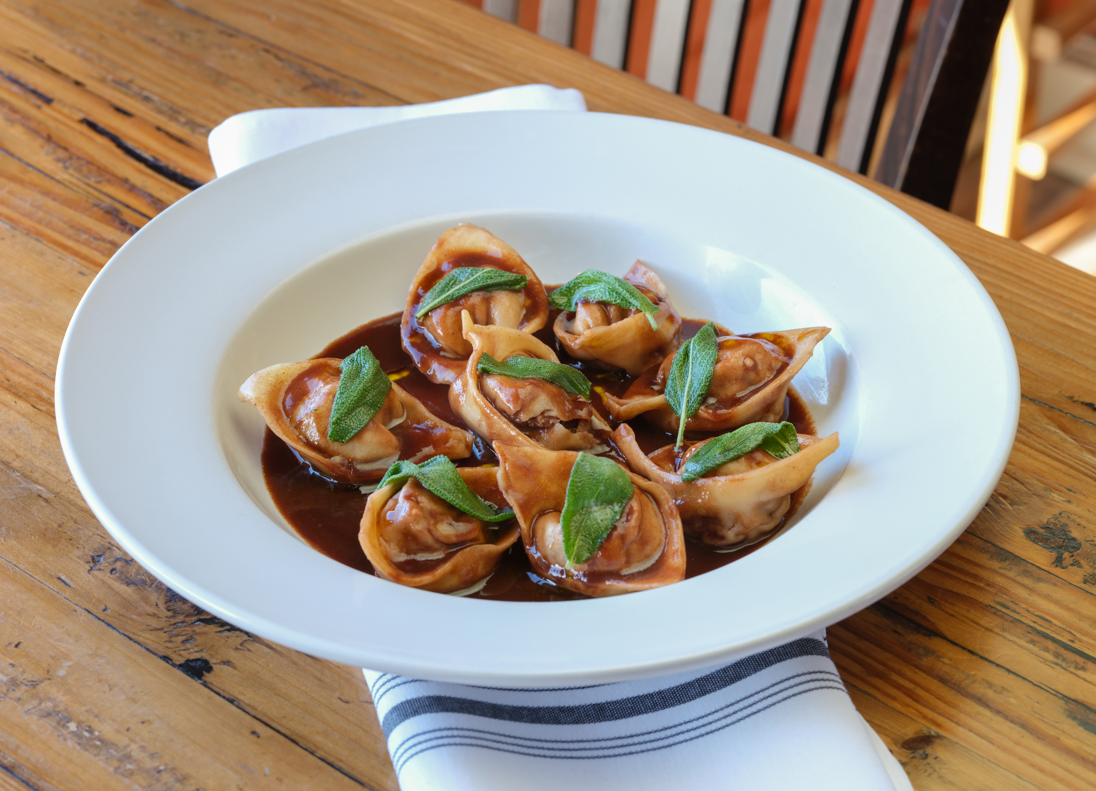a plate of food sitting on top of a wooden table