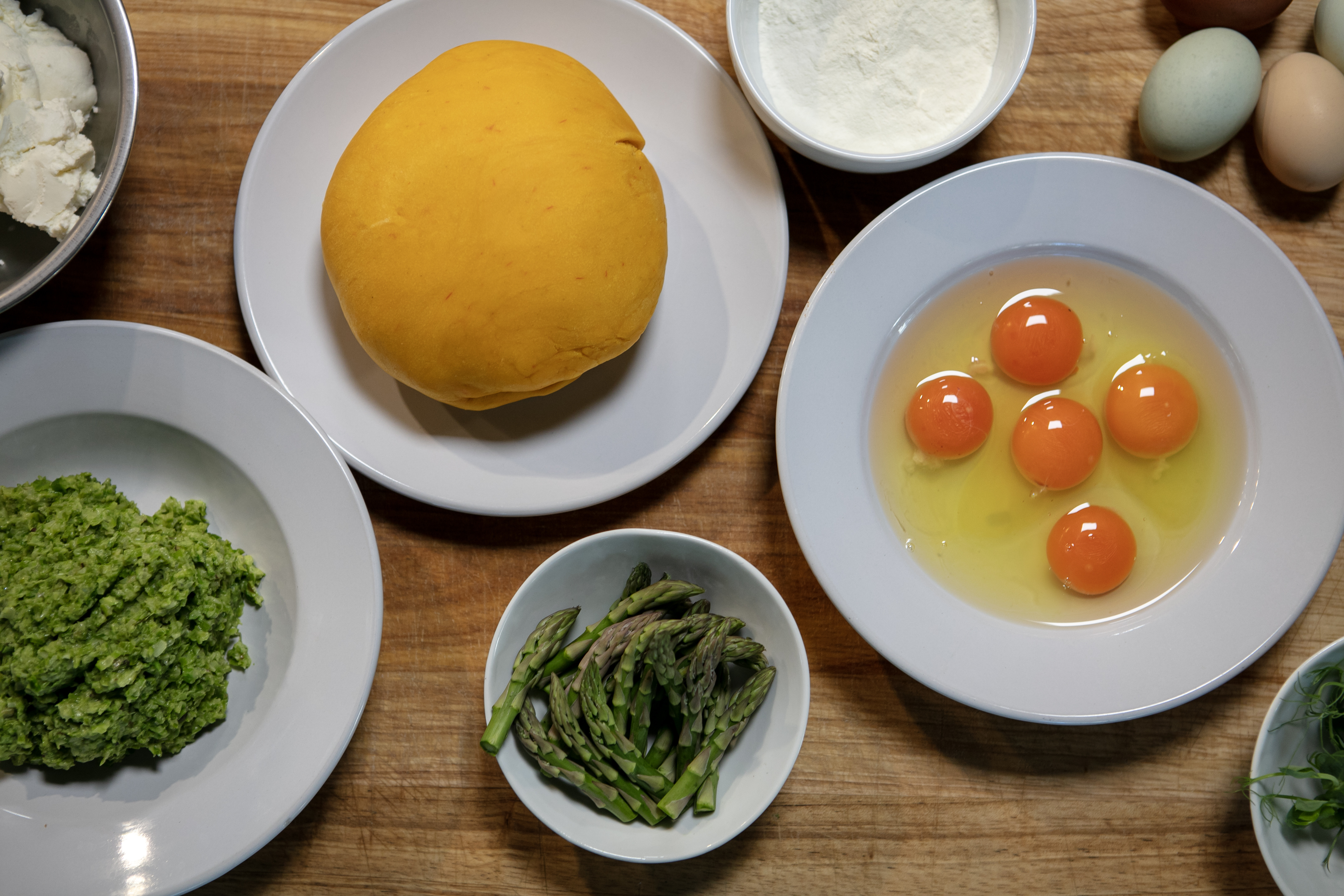 a bowl of food on a plate on a table