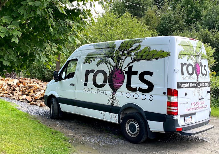 a van parked on the side of a truck
