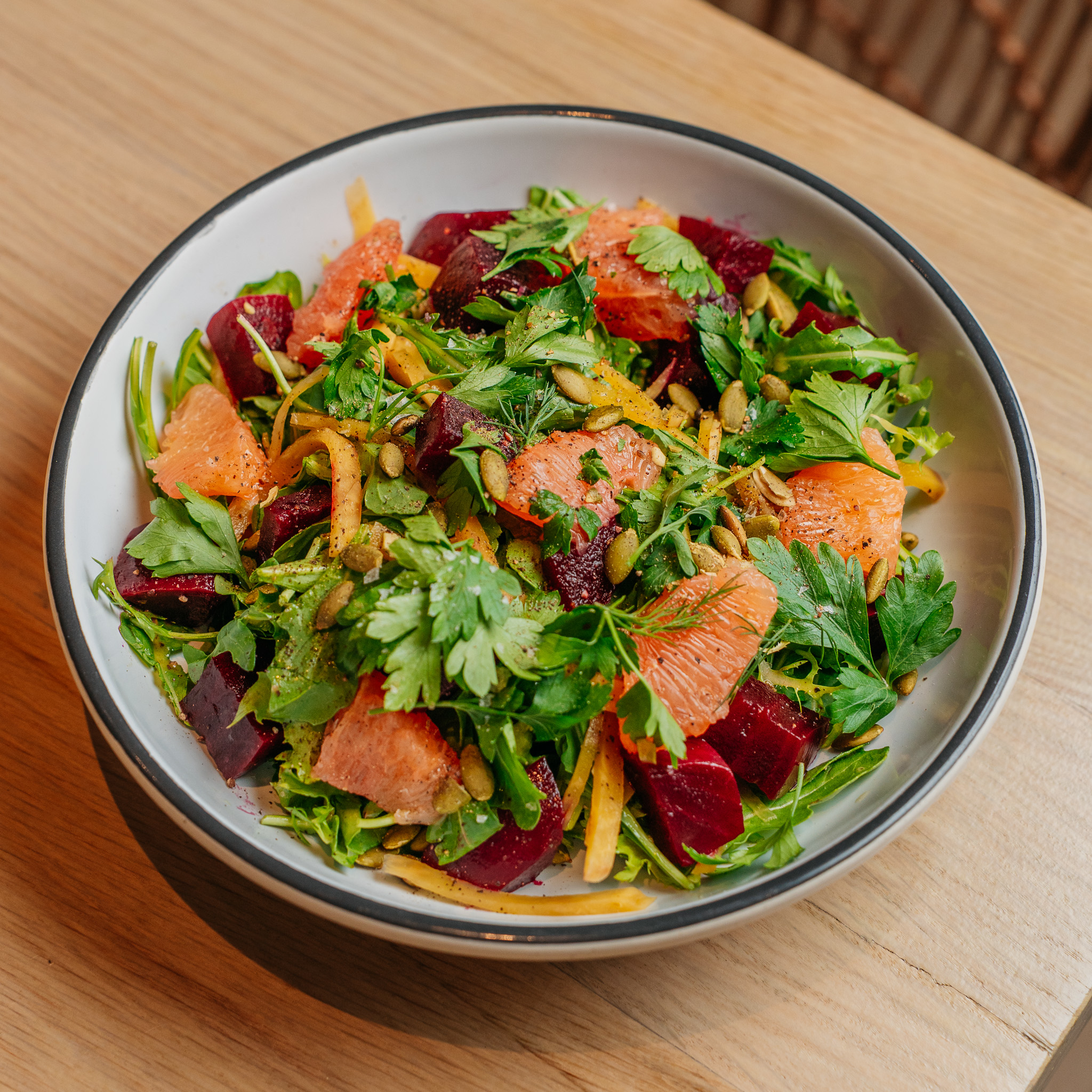 a bowl of salad on a table