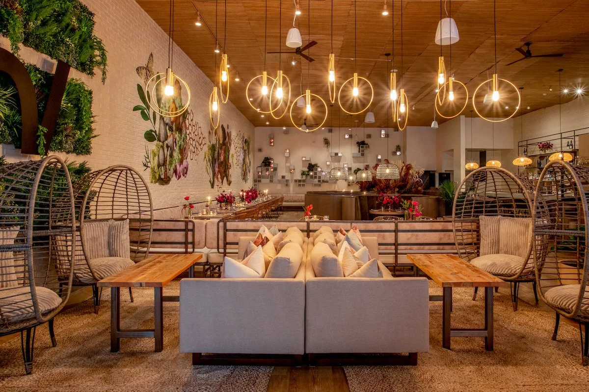 a room filled with furniture and vase on a table