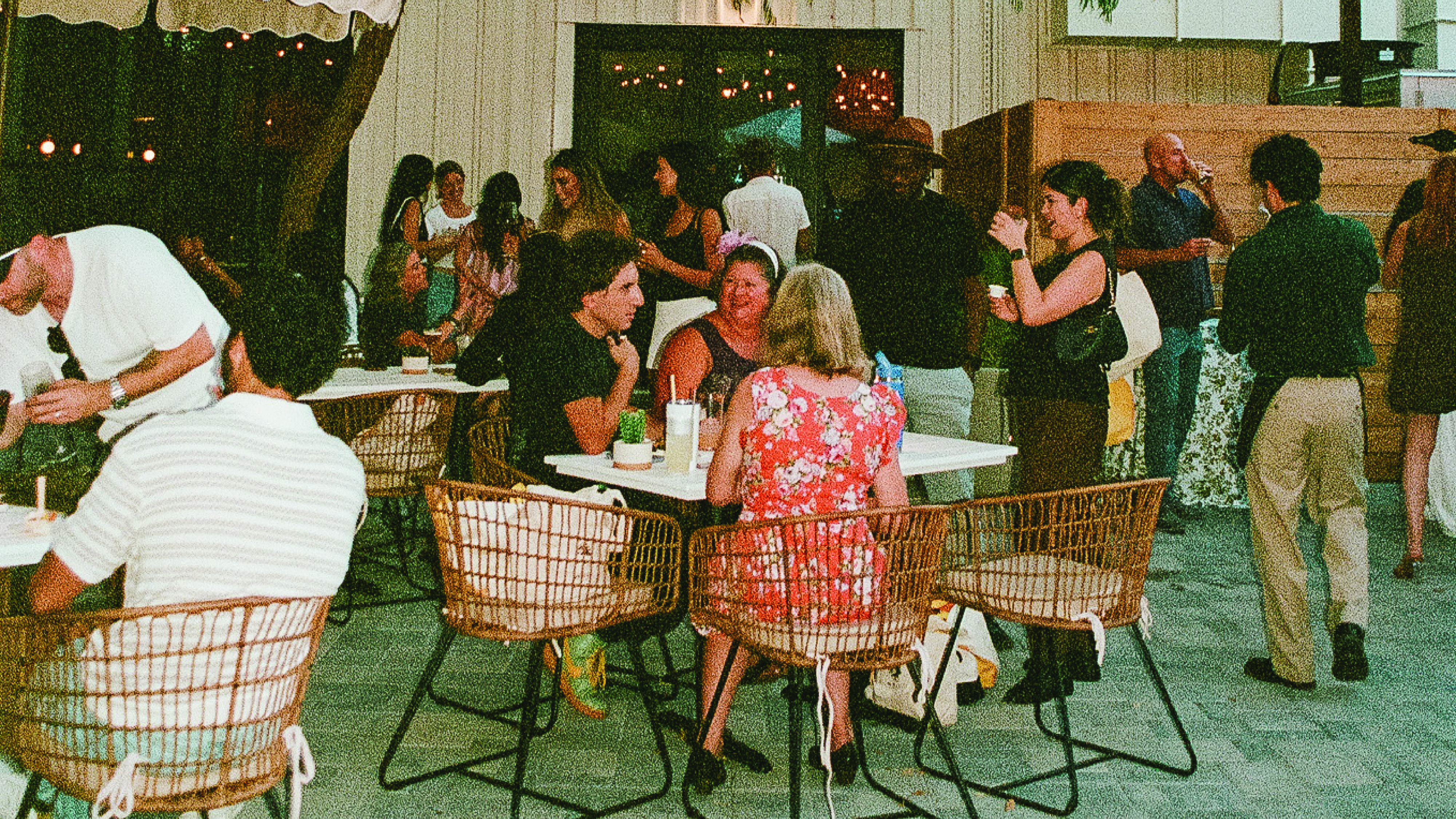 a room filled with furniture and vase of flowers on a table