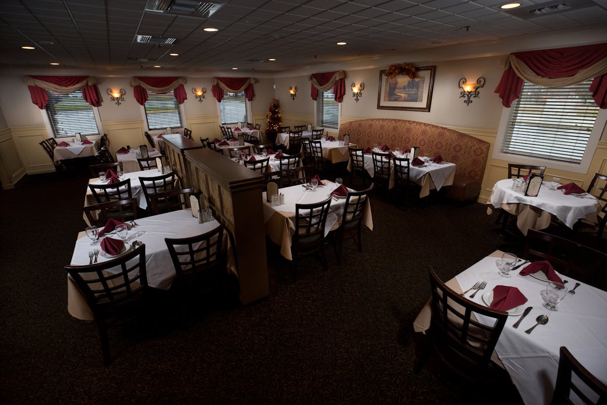 restaurant interior with tables and chairs 