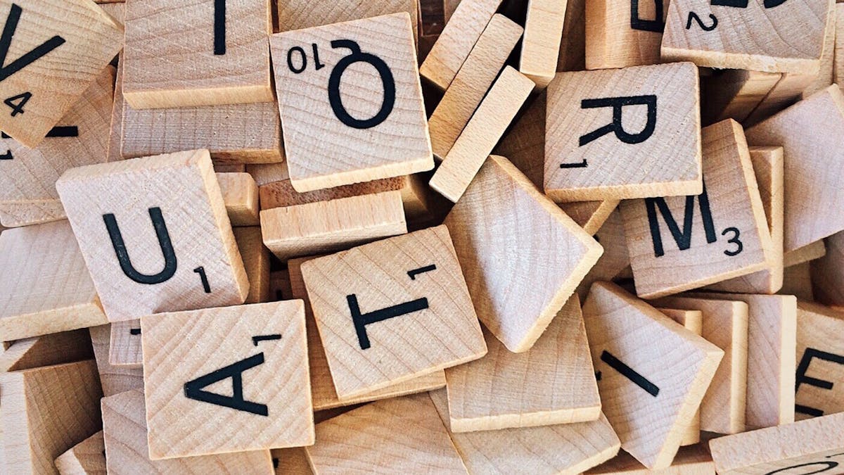 scrabble wooden letters scattered