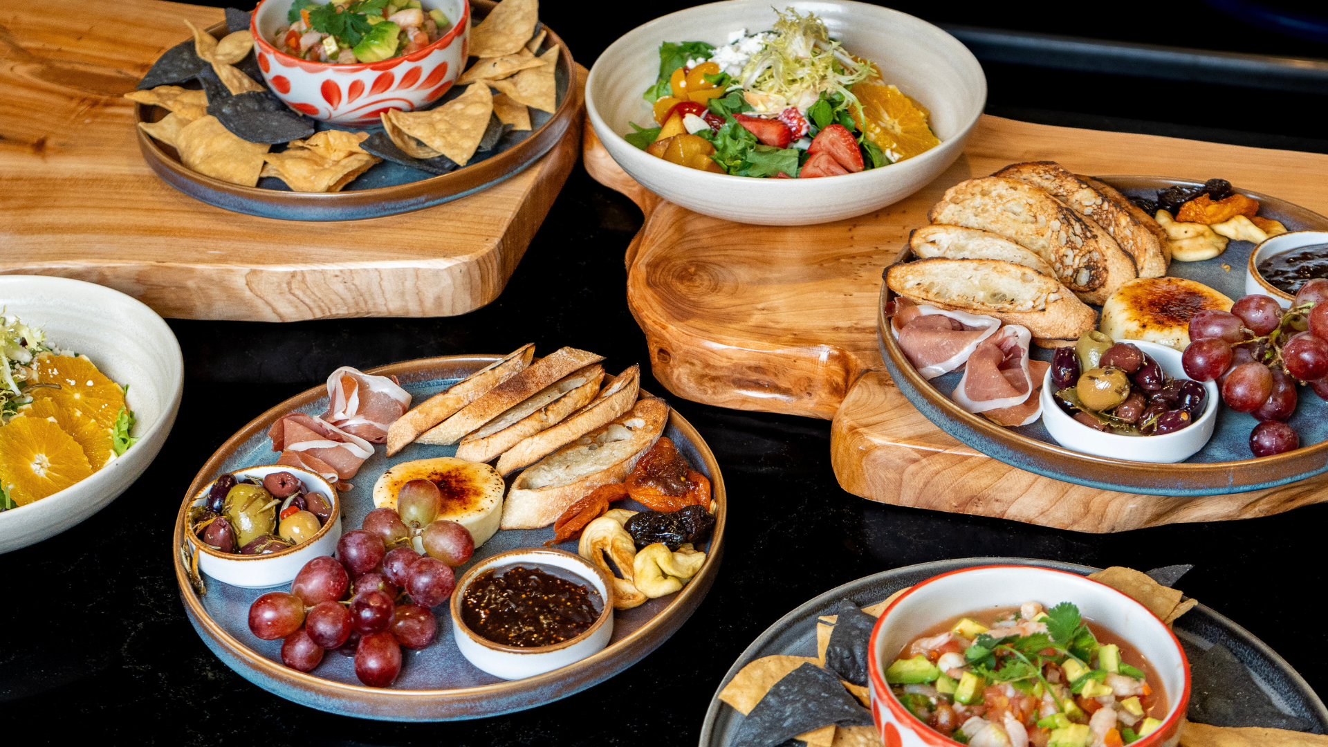 a group of plates of food on a table