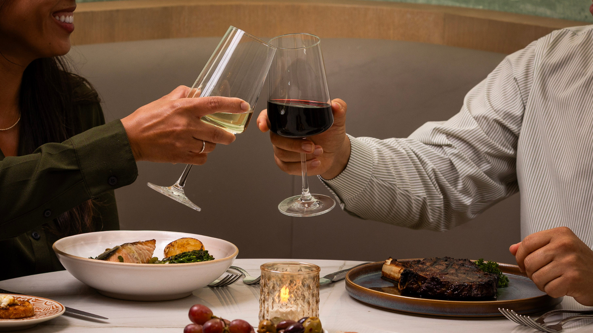 a couple of people holding wine glasses