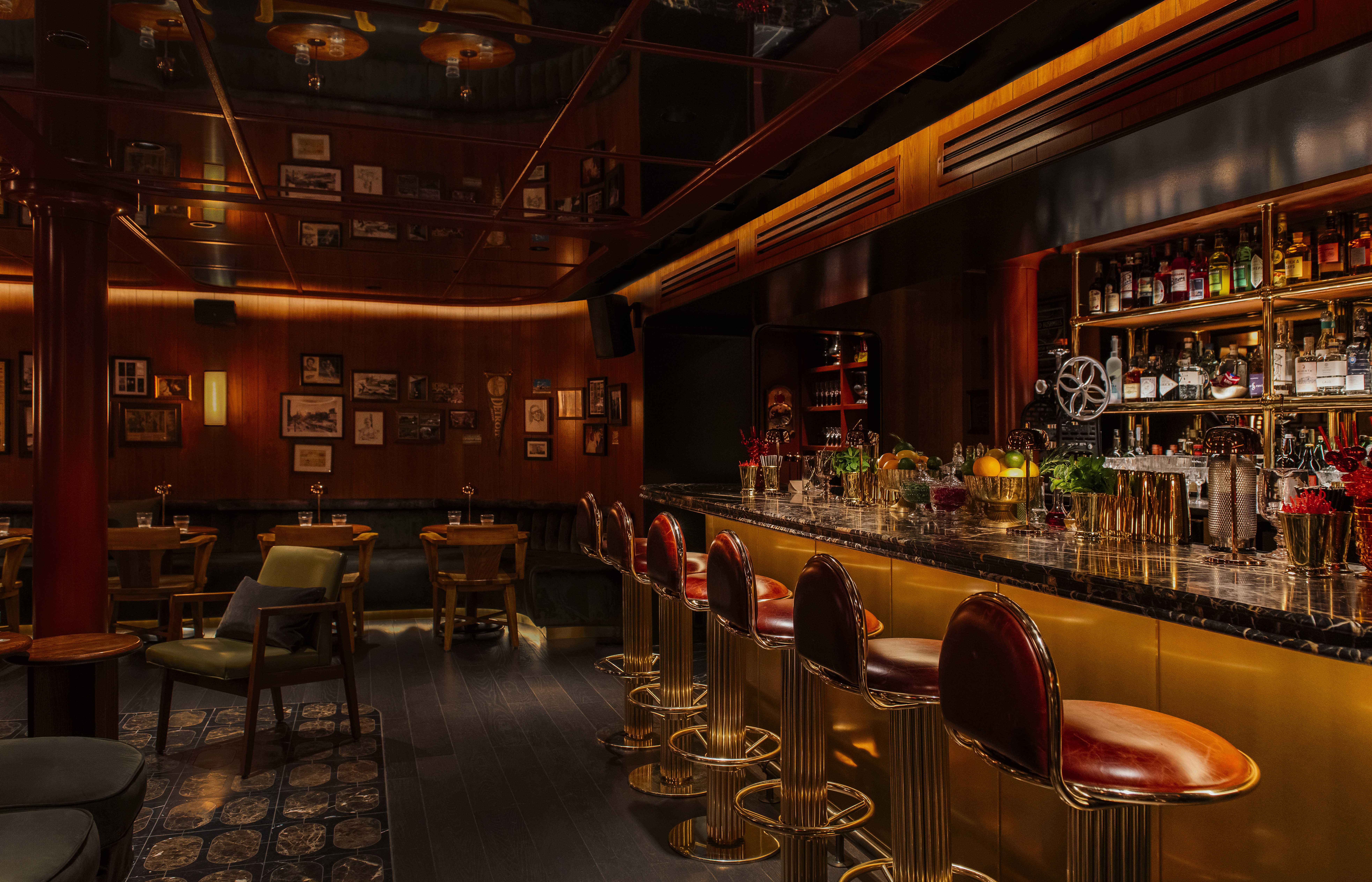 a group of people sitting at a table in a library