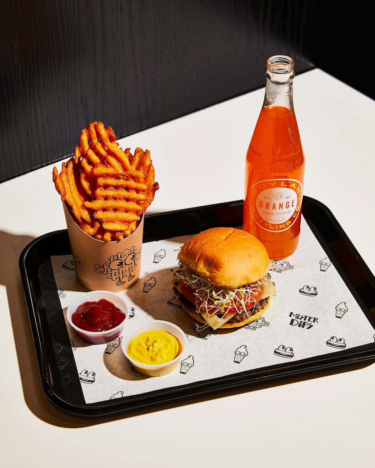 a plate of food and a bottle on a table