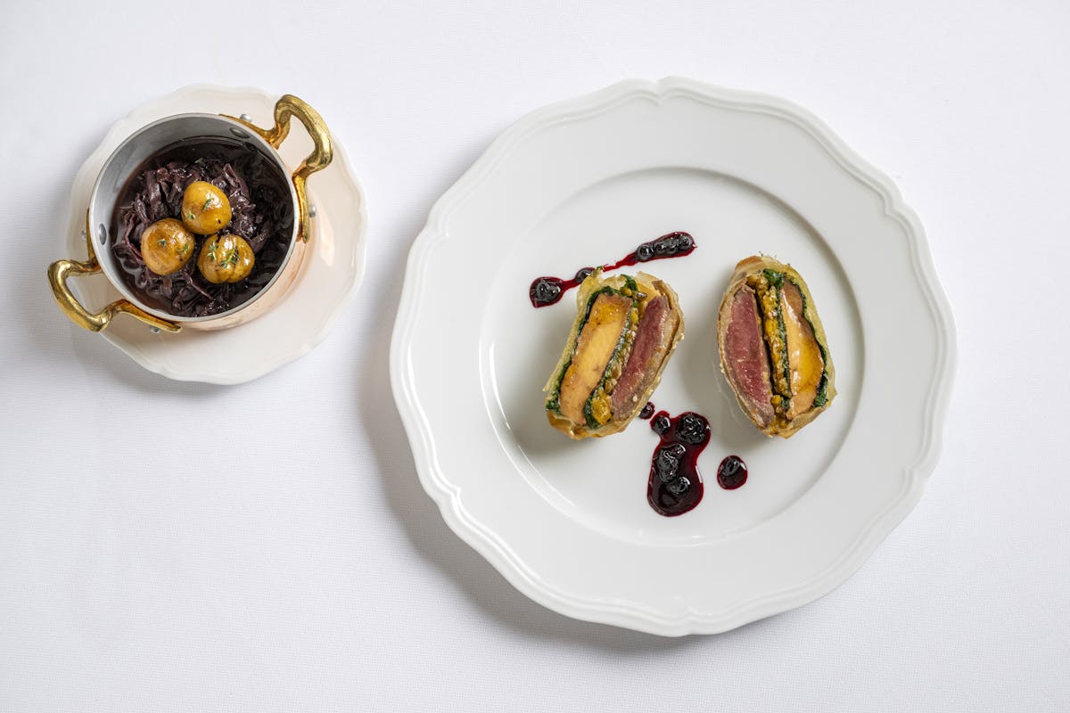 a plate with a piece of cake on a table