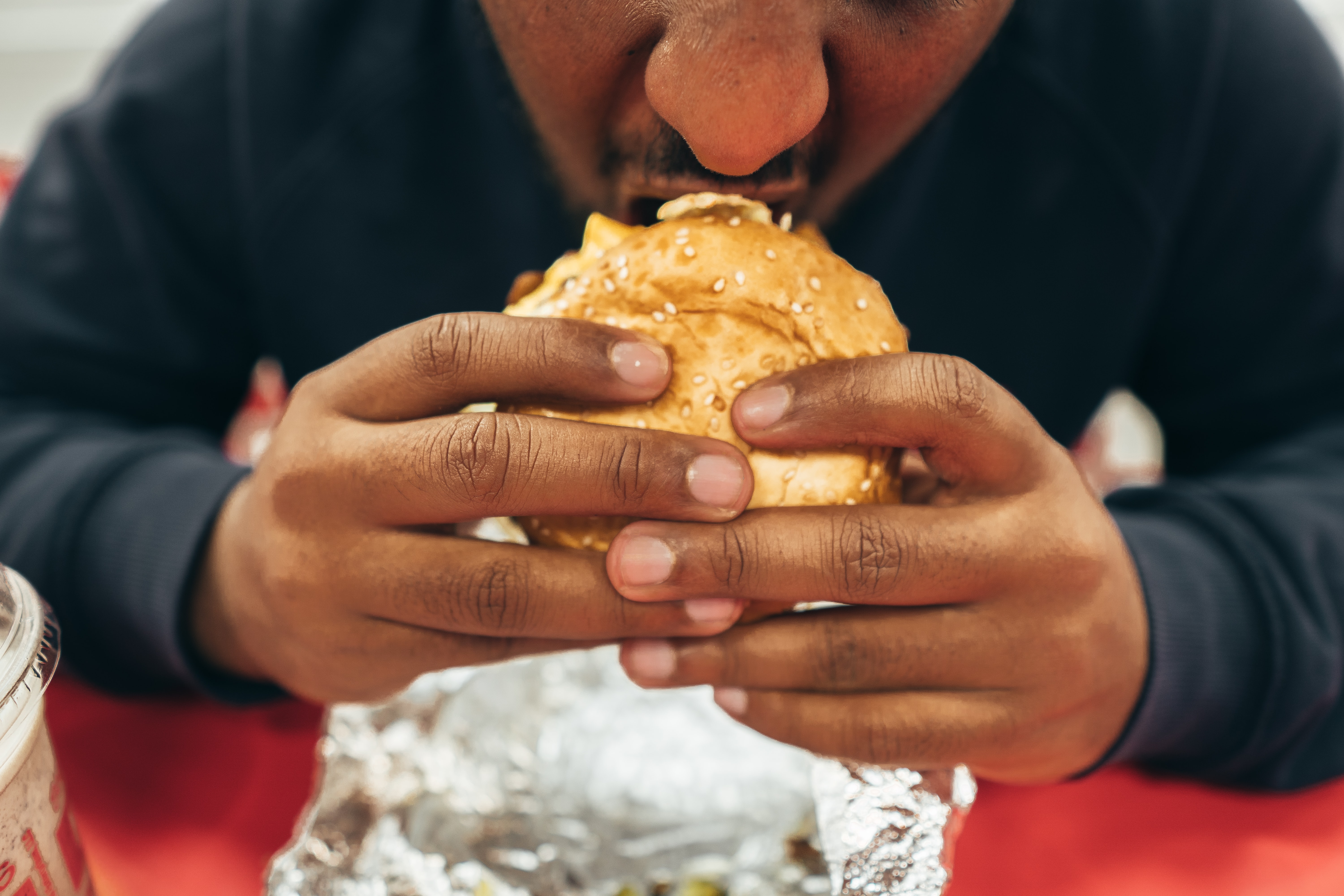 a man eating a donut