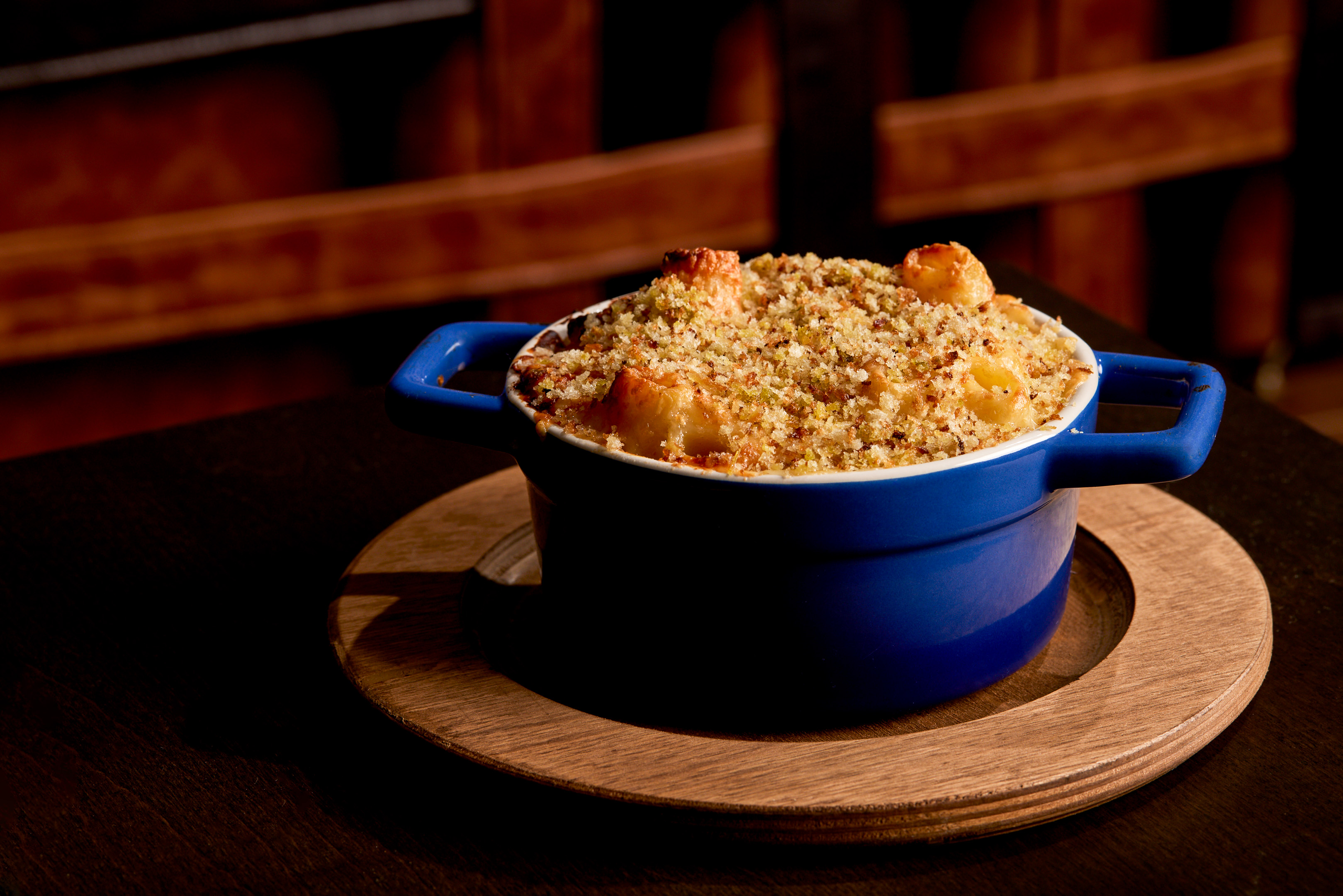 a cup of coffee sitting on top of a wooden table