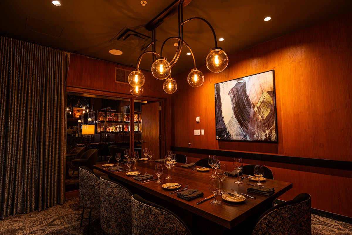 a kitchen with a table in a dark room
