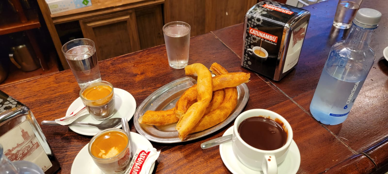 a plate of food and a cup of coffee on a table
