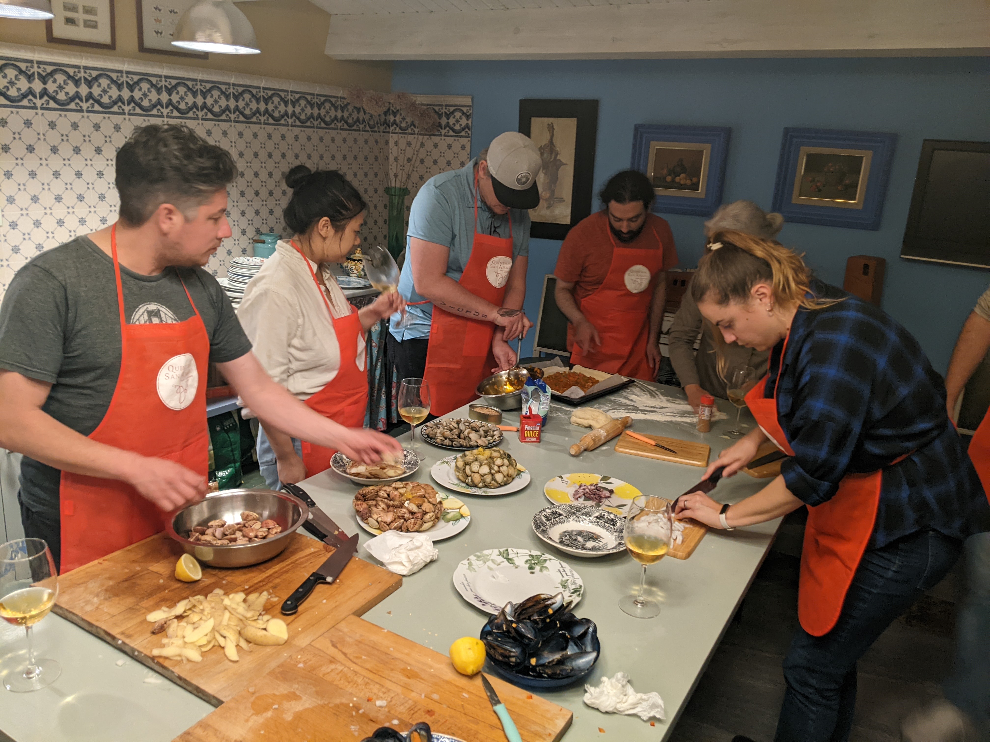 a group of people sitting at a table eating food