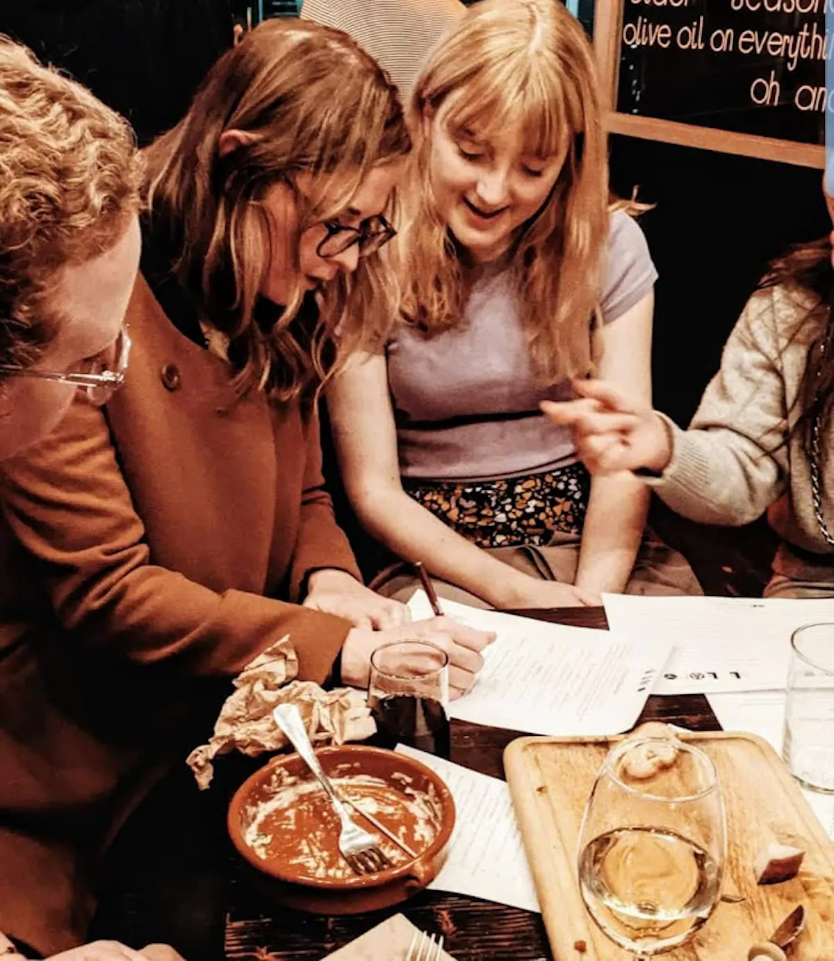 a group of people sitting at a table