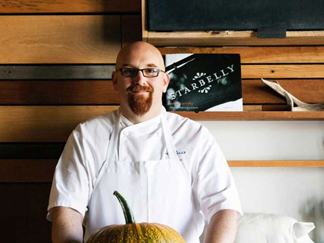a man holding a fish