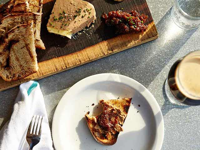 a plate of food with a slice of pizza