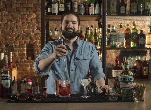 A man stirring a drink