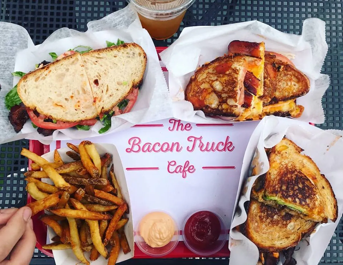 a plate of food with a sandwich and fries on a table