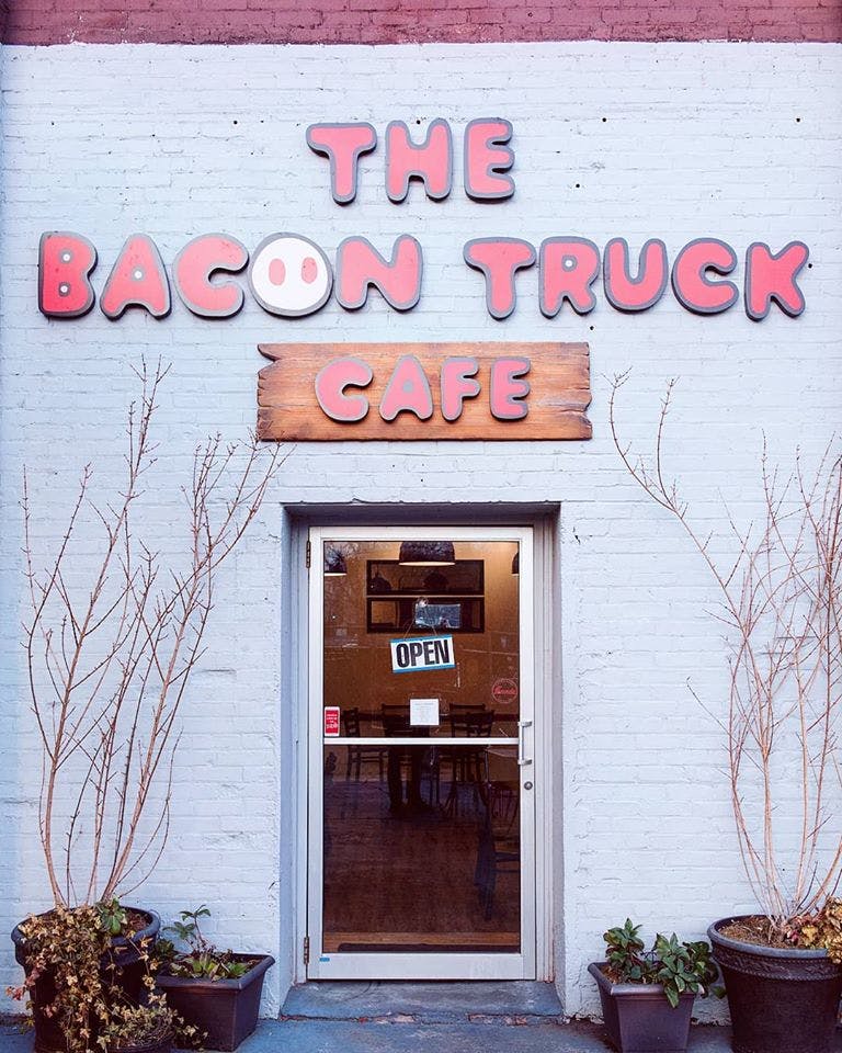 a sign in front of a brick building