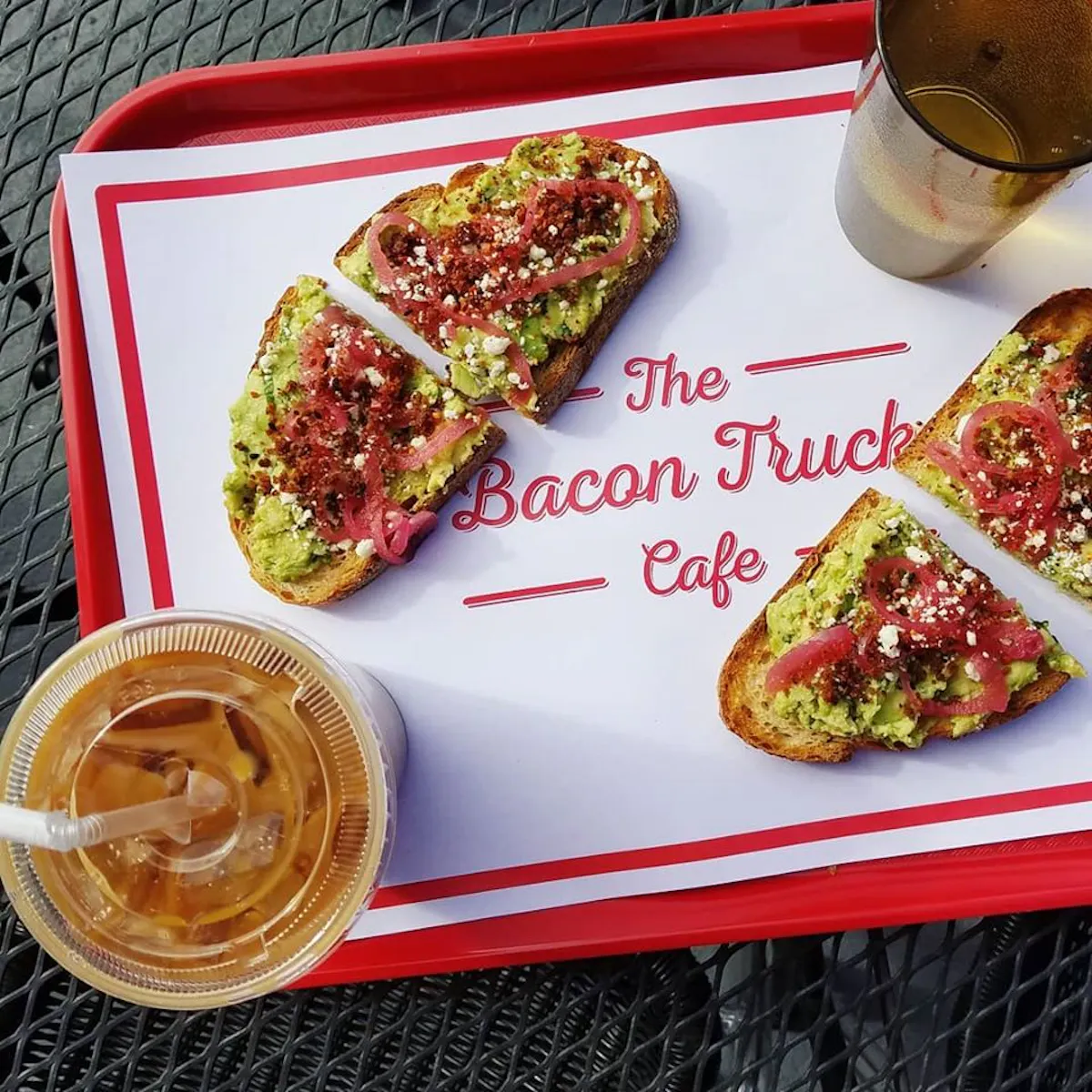 a plate of food with a slice of cake on a table