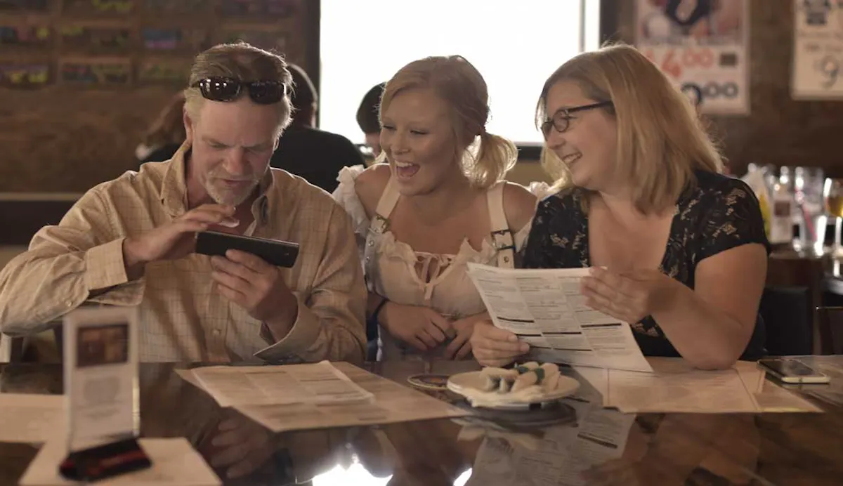 a group of people sitting at a table
