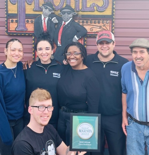 a group of people posing for a photo