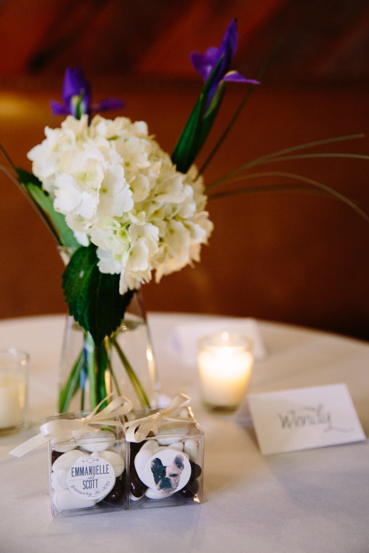 a vase with white roses sitting on a table