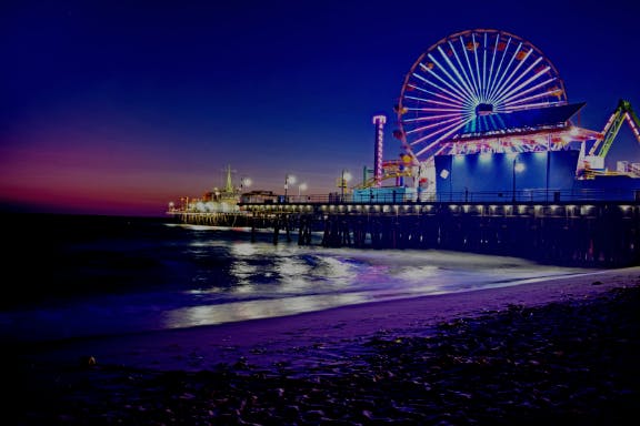 a close up of the coast of Santa Monica at night