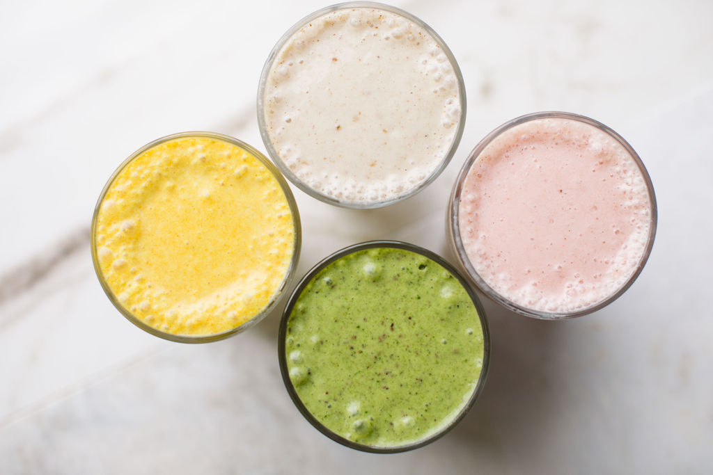 four glasses of juice