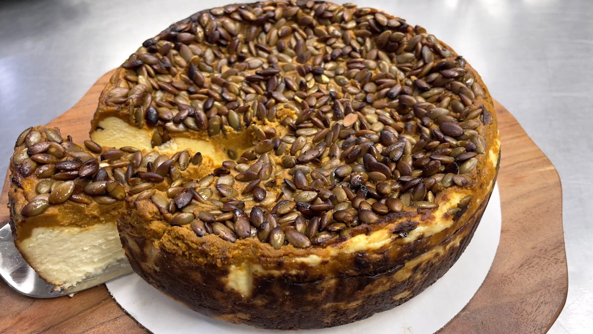 pumpkin cheesecake with a slice cut out