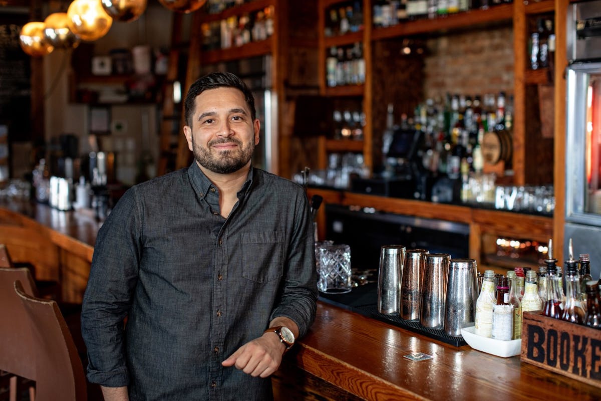a man sitting at a table in a restaurant