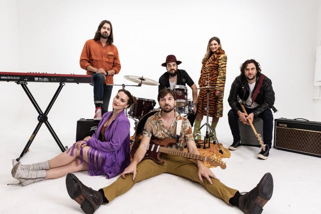 a group of people sitting posing for the camera
