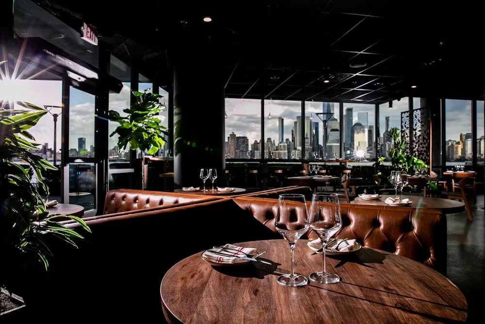 a living room filled with furniture and vase on a table