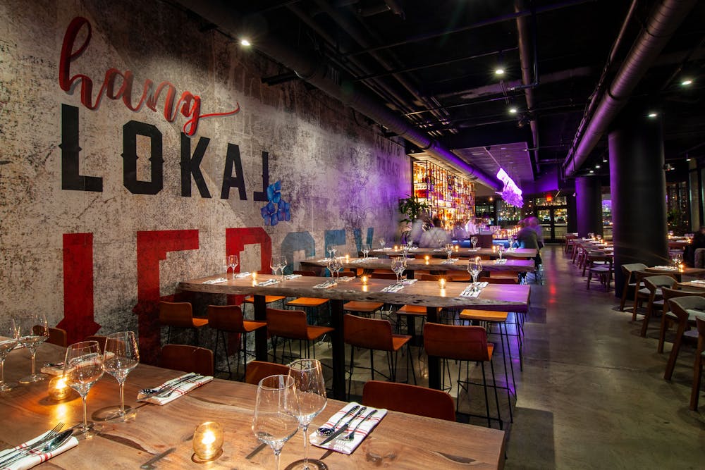 a person sitting at a table in a restaurant