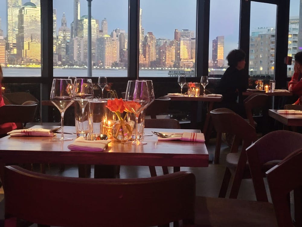 a group of people sitting at a table in a restaurant