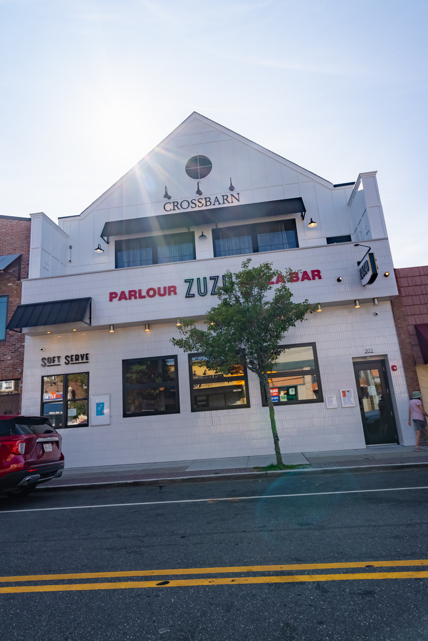 a building with a store on the corner of a street