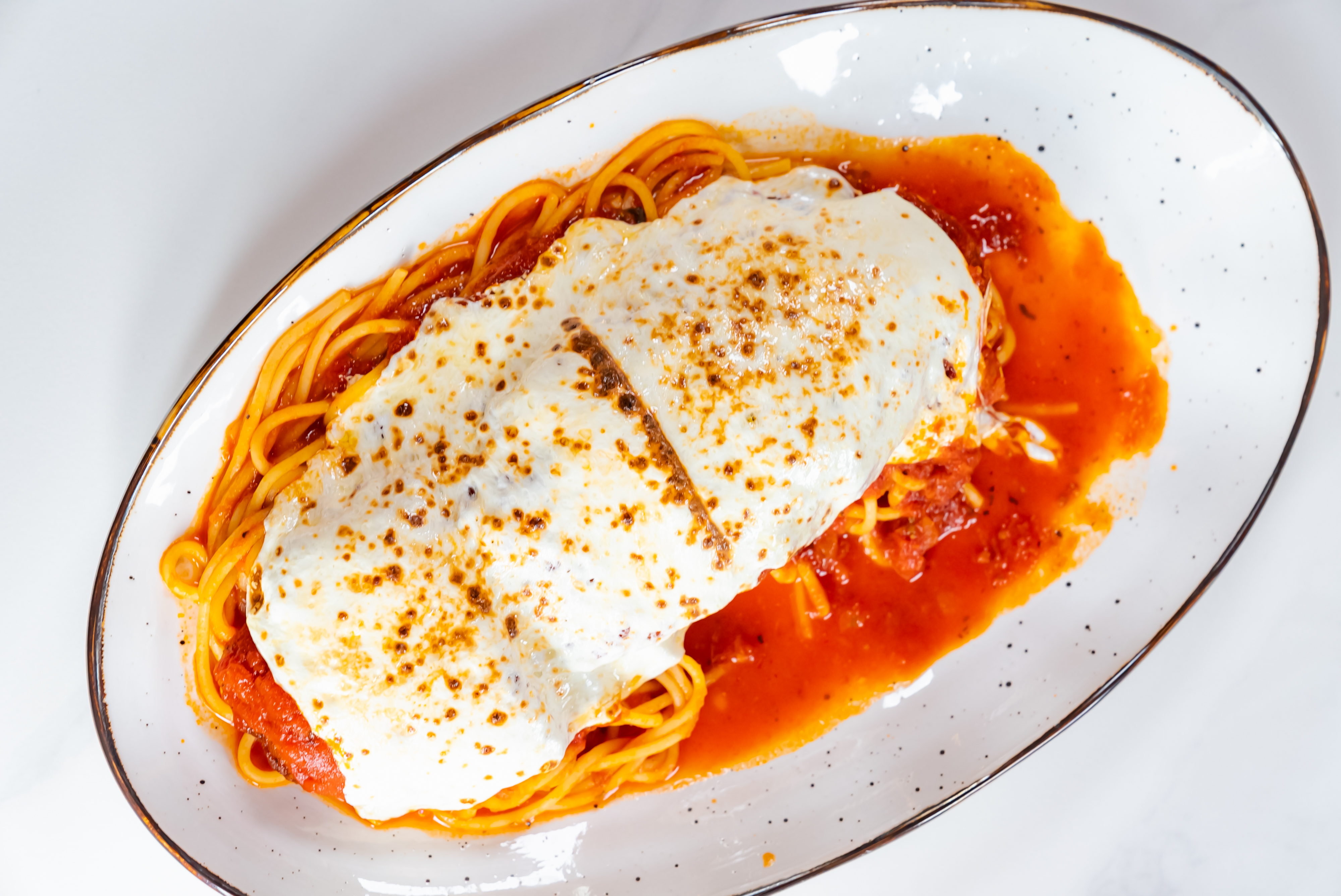 a plate of food with a slice of orange